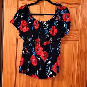 Short sleeve blouse.  Size L  blue, red, teal, white are the colors of this blou